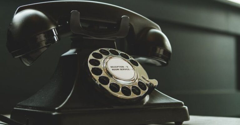 Services - Black Rotary Telephone on White Surface