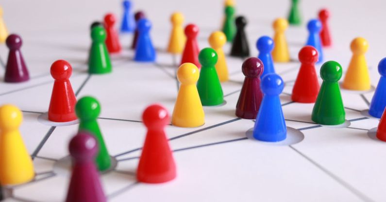 Network - Close Up Photography of Yellow Green Red and Brown Plastic Cones on White Lined Surface