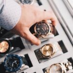 Collection - Person Holding Round Gold-colored Analog Watch With Link Bracelet