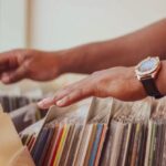 Records - Person Selecting Different Albums