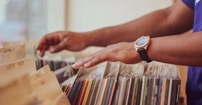 Records - Person Selecting Different Albums