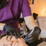 Treatments - Woman Getting a Facial Treatment Done by a Beautician