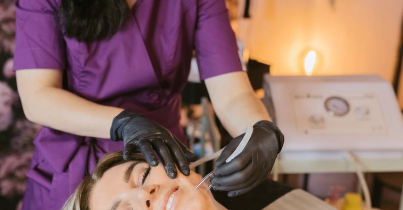 Treatments - Woman Getting a Facial Treatment Done by a Beautician