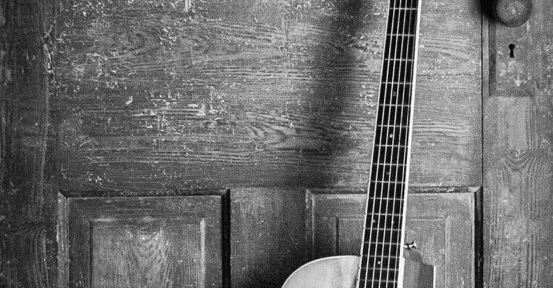 Music - Brown and Black Cut-away Acoustic Guitar