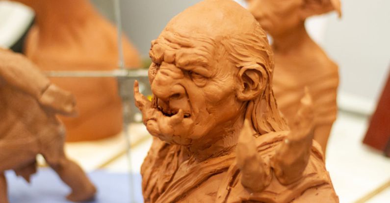 Genres - Earthen figurine of angry fictional creatures