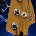 Bass - Close-Up Photography of Brown Fender Guitar Headstock