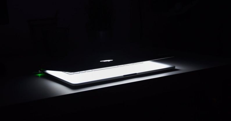 Setup - Photography of Macbook Half Opened on White Wooden Surface