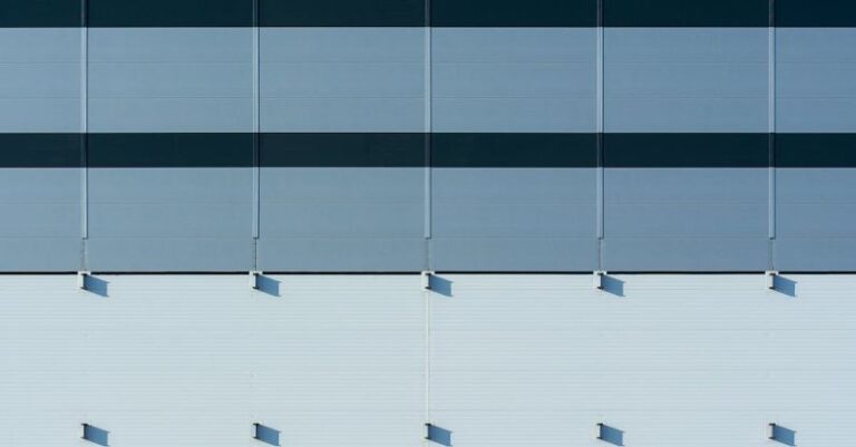 Panels - A close up of a building with blue and white stripes