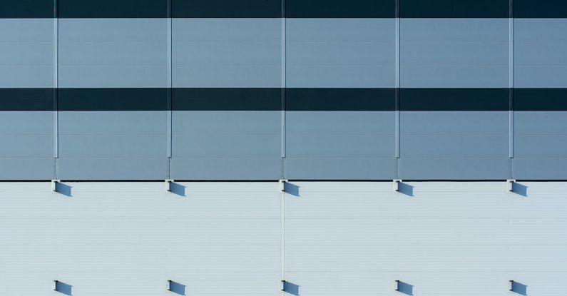 Panels - A close up of a building with blue and white stripes