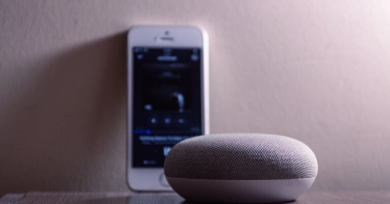 Speakers - Gray Google Home Mini Beside Silver Iphone 5s